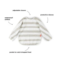 Done By Deer Sleeved Pocket Bib - Stripes - Sand 11 Done By Deer Sleeved Pocket Bib - Stripes - Sand -Done By Deer Sleeved pocket bib Stripes Sand Function 4 PS